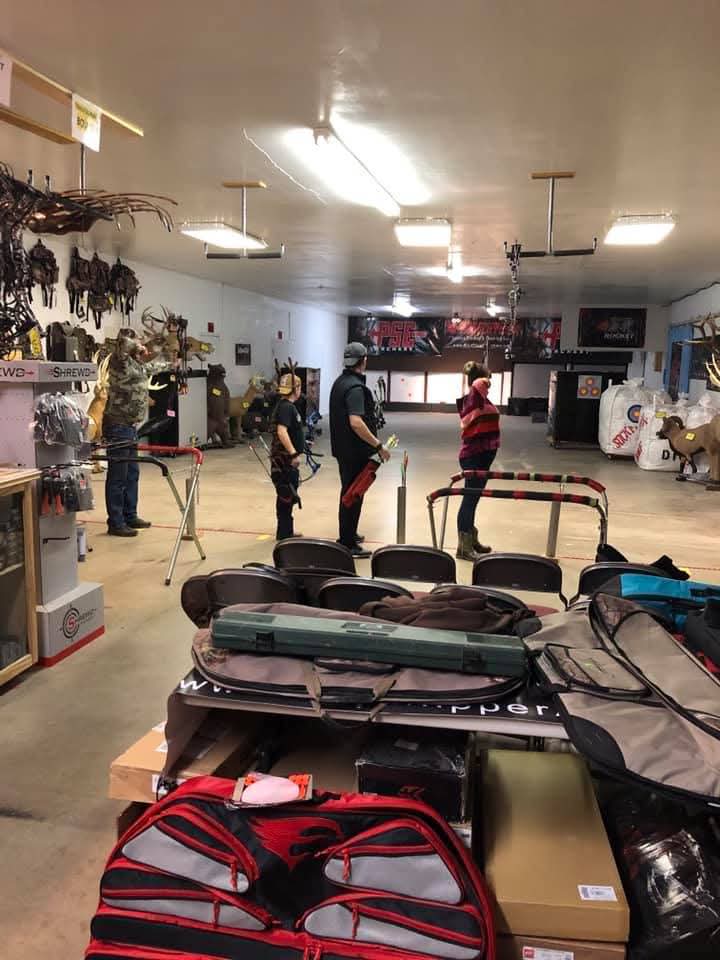 Archers on the line in the Stickflipper Archery shop