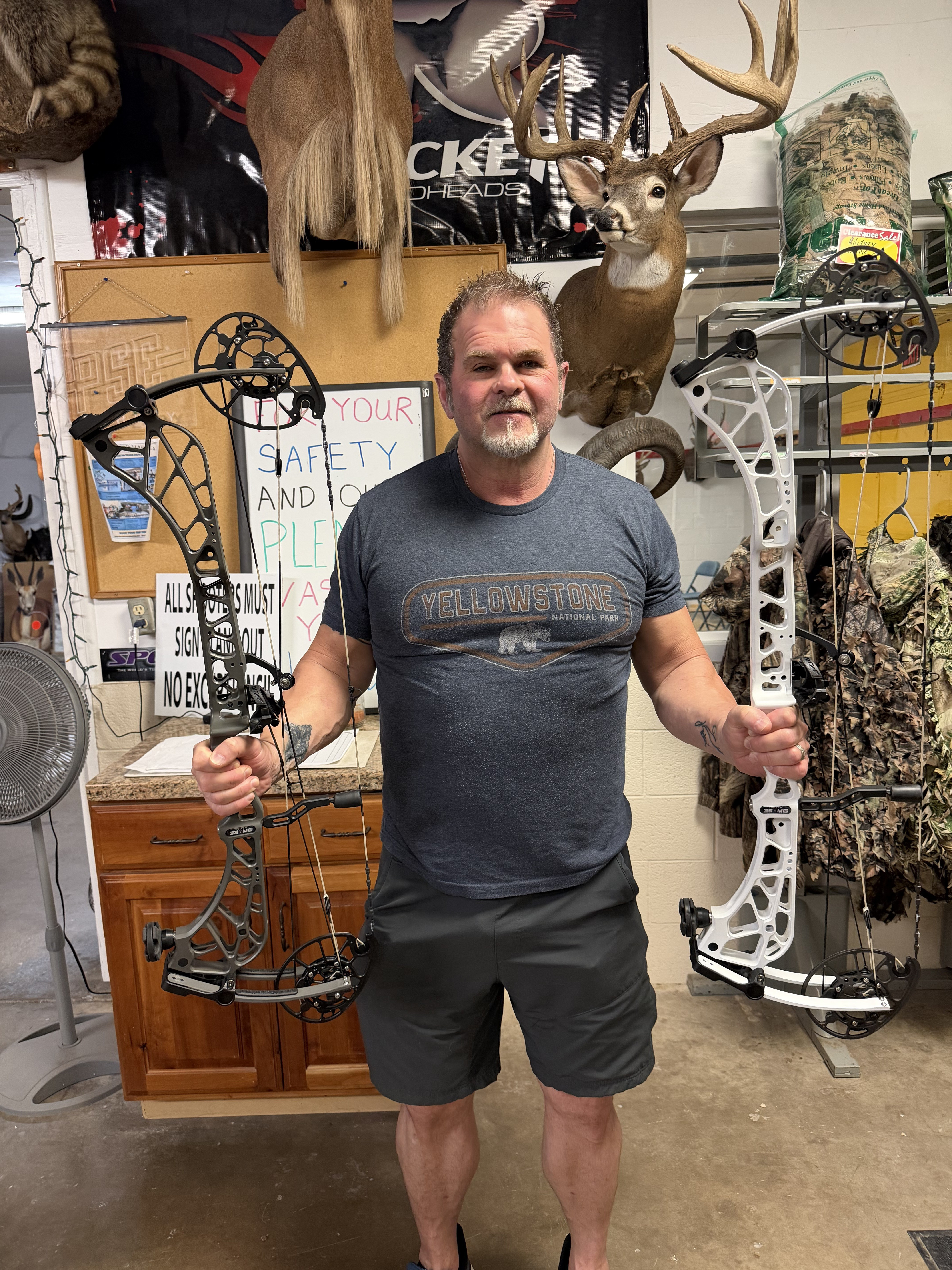 Rick with Kevin Strother holding a pair of new Fusion bows